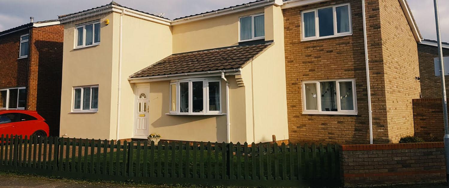 Complete EWI 2 External Wall Insulation applied to a property in the sun