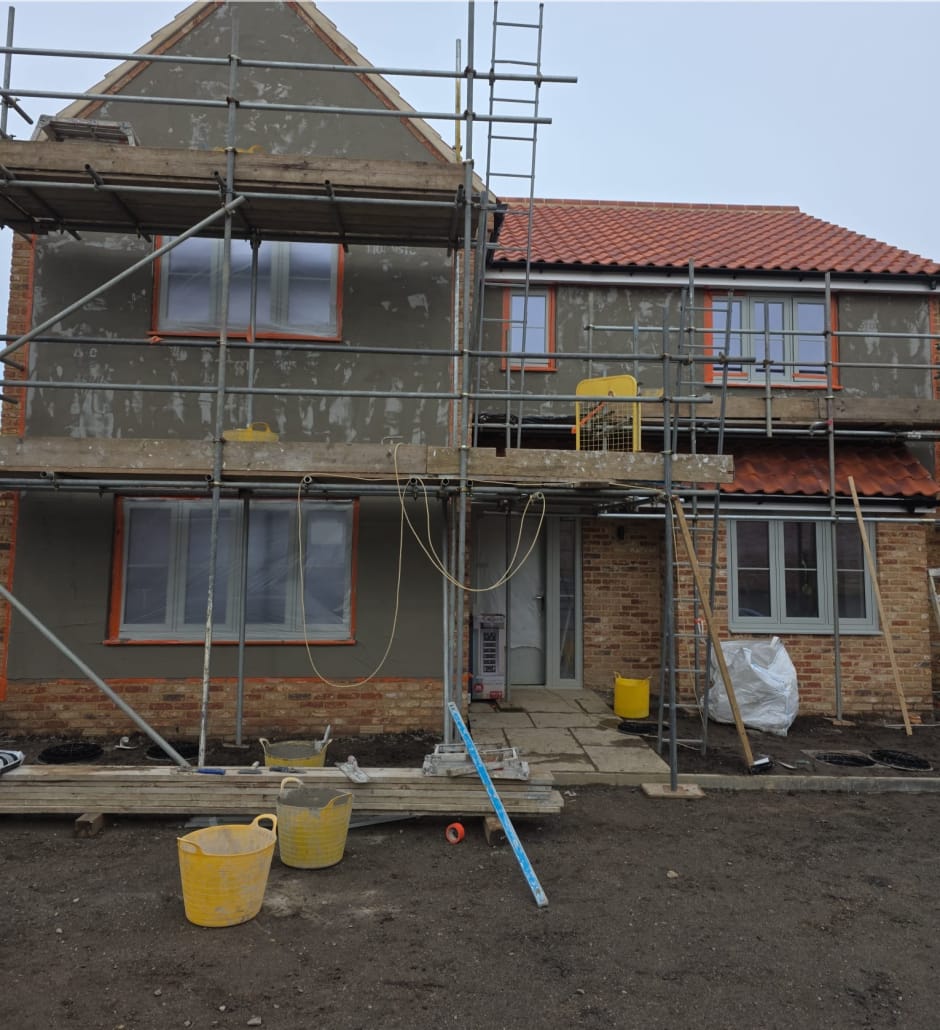 Basecoat applied to new build home ahead of silicone rendering in Great Moulton, Norfolk