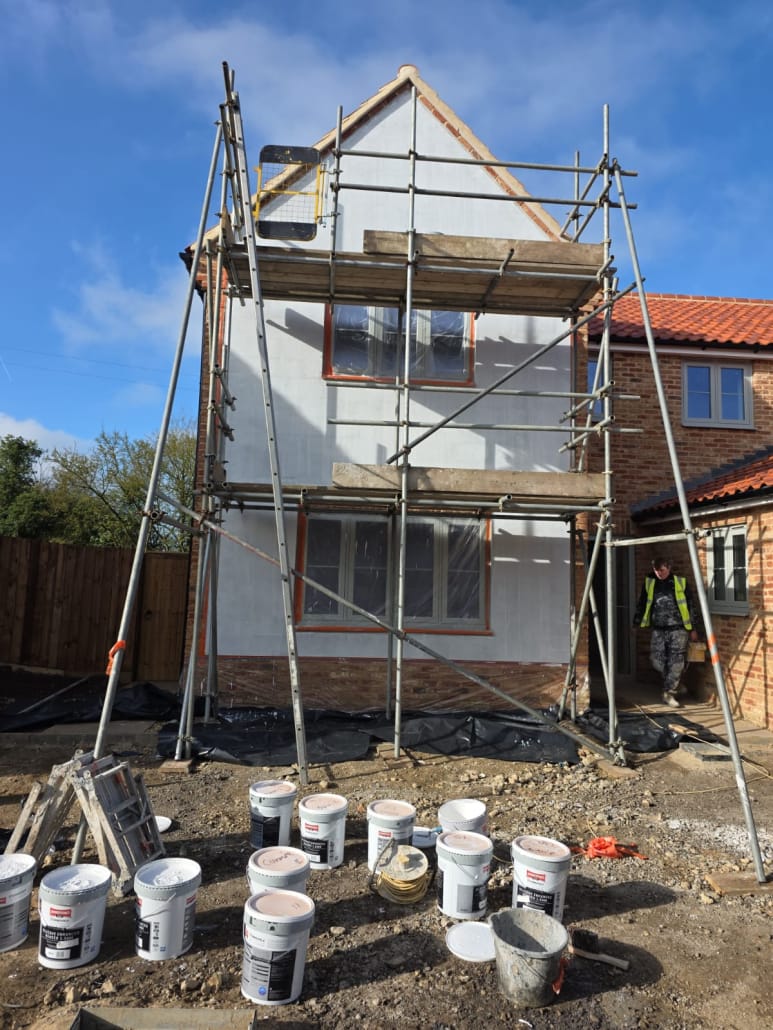 New build gable wall masked and prepared for silicone render application