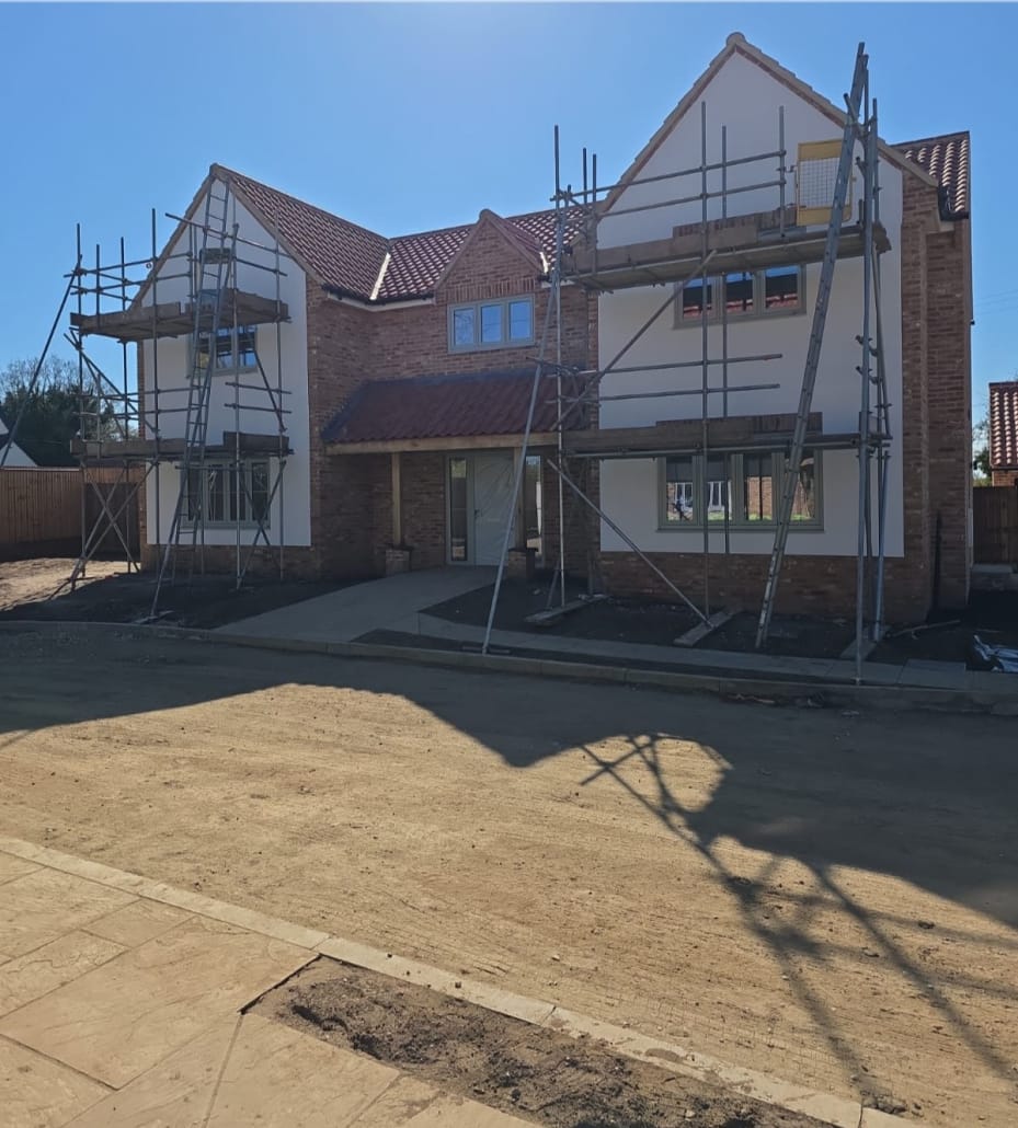 New build wall prepared for silicone render application New build wall with silicone render application