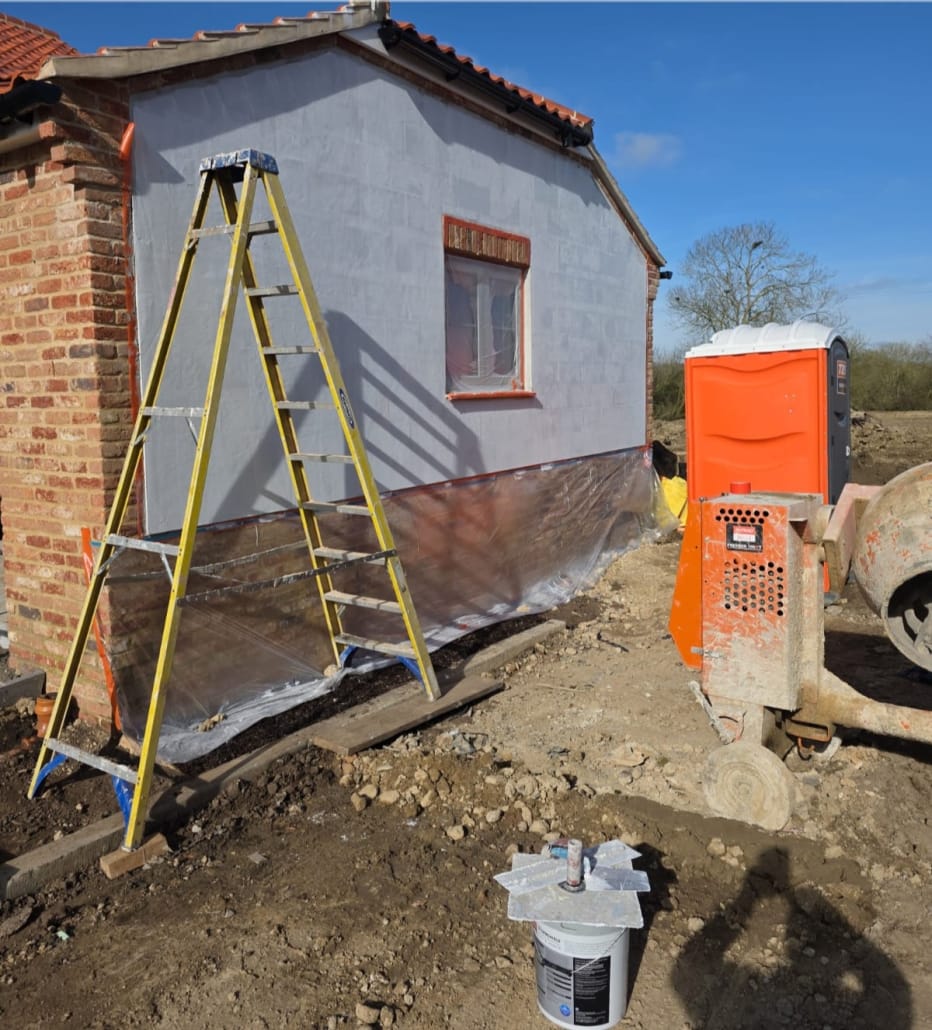 Primed wall ready for silicone render topcoat on new build property